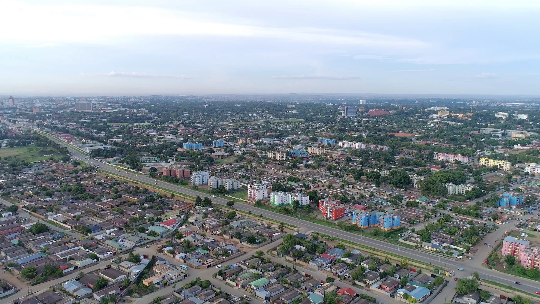 An aerial view across the buildings and tree-lined streets of Lusaka, Zambia